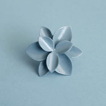 Load image into Gallery viewer, Fine ring close-up: contemporary porcelain jewelry. Stunning blue flower ring on a blue background.