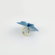 Load image into Gallery viewer, A close-up image of a porcelain floral ring, showcasing its intricate details and delicate craftsmanship.