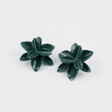 Load image into Gallery viewer, Soft grey background. Deep green porcelain earrings. Timeless petal-inspired jewelry. A close-up image of a pair of porcelain floral earrings, showcasing its intricate details and delicate craftsmanship.