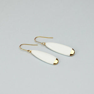 Light grey background for minimal white porcelain earrings, hand-painted with 24k pure gold.