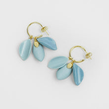 Load image into Gallery viewer, Contemporary light blue porcelain earrings close-up. Each has 3 petals molded by hand.
