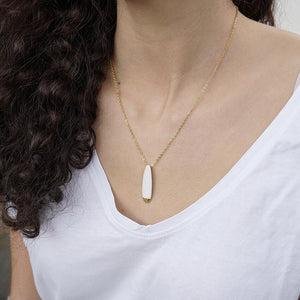 White and gold porcelain necklace. Delicate and elegant golden chain. 