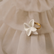 Load image into Gallery viewer, A white porcelain bridal ring, exuding elegance and purity, perfect for a bride&#39;s special day.