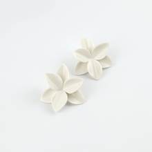 Load image into Gallery viewer, A collection of white porcelain floral earrings designed specifically for brides, adding an elegant and delicate touch to their hairstyle.