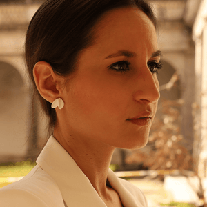 A bride wearing exquisite porcelain jewelry, adding a touch of sophistication and elegance to her bridal look. Perfect for minimal or civil wedding. 