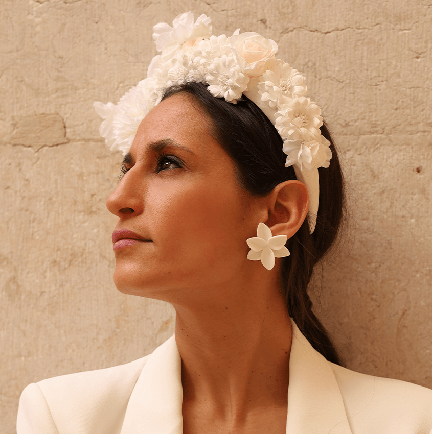 Bridal jewellery: white porcelain flower earrings. Bride wearing a flower headband matching the earrings.