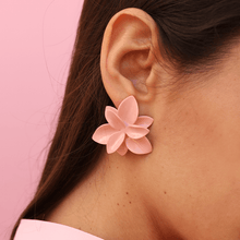 Load image into Gallery viewer, Detailed scene of elegant soft pink flower earrings. Colorful image. Woman wearing a sublime art accessory. 