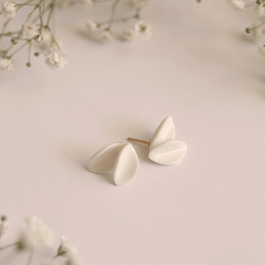 Beautiful petals-shaped porcelain earrings displayed on a light background, highlighting their elegance and craftsmanship.