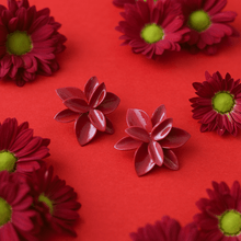 Load image into Gallery viewer, A red garden composed of porcelain flowers and real flowers. Both are red, as the background. Bright photography.