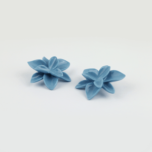 A close-up view of blue porcelain flowers, showcasing their intricate details and delicate beauty.