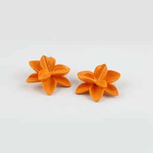 A pair of elegant strong orange porcelain flower earrings, featuring intricate petal details and a delicate design.