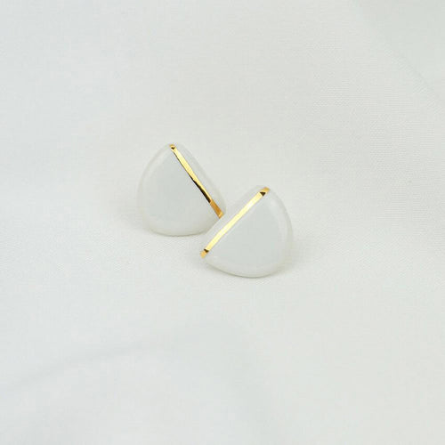 Lightweight minimal porcelain earrings. Clean background.