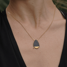 Load image into Gallery viewer, Black porcelain necklace covered in a matte glazed layer. 24k gold luster. Black pendant.