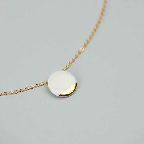 Clay exclusive design. White and gold jewel. 