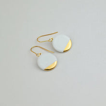 Load image into Gallery viewer, Round white porcelain earrings. Bright product photography. 