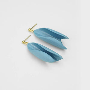Soft blue earrings handmade in Portugal. Gold-filled ear studs. Studio photography.
