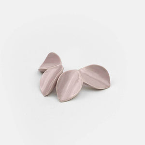 Jewelry manufactured in Portugal. Exclusive design handmade with porcelain. Lavender color. Light grey background. 