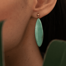 Load image into Gallery viewer, Green porcelain earring with foral design. Close-up photograph. 