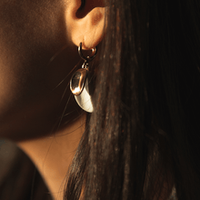 Load image into Gallery viewer, Dangle earrings: two porcelain pieces (white and gold). Sunny light photograph.
