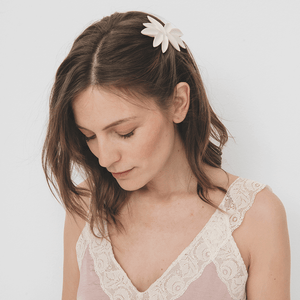 Handmade white porcelain hair piece. Young woman wearing a unique accessory. Bridal vibes. 